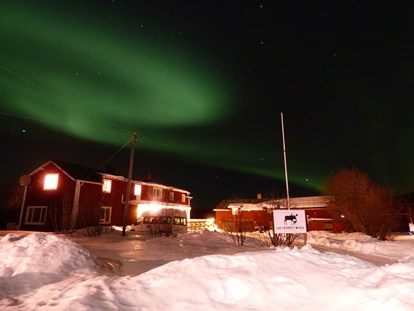 Rollstuhlgerechte Unterkunft - Unterkunftsart: Gästehaus - Norrbottens - The beautiful Northern Lights over The Friendly Mose - The Friendly Moose Lapland