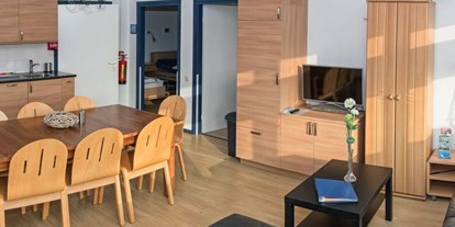 Rollstuhlgerechte Unterkunft - Pflegebett - Wohnraum - Modestia Groepsverblijf Texel