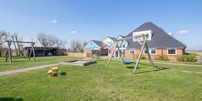 Rollstuhlgerechte Unterkunft - Kinderspielplatz - Modestia Groepsverblijf Texel