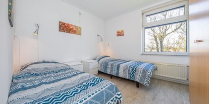 Rollstuhlgerechte Unterkunft - Pflegebett - Helle, freundliche Zimmer - Modestia Groepsverblijf Texel
