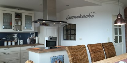 Rollstuhlgerechte Unterkunft - Rügen - Komfortküche mit umfahrbarer Kochinsel Ferienhaus"Rügen-Traum" - Ferienhaus“Rügen-Traum“ für bis zu 8 Personen auf Rügen