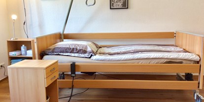 Rollstuhlgerechte Unterkunft - Unterkunftsart: Ferienhaus - Pflegebett - Ferienhaus am LEWITZrand