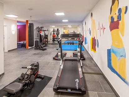 Rollstuhlgerechte Unterkunft - Unterkunftsart: Ferienhaus - Der Fitnessraum im Kellergeschoss mit Infrarotkabine und Sauna lässt keine Wünsche offen. - Feriendomizil Nordstern
