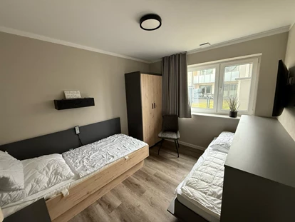 Rollstuhlgerechte Unterkunft - Unterkunftsart: Ferienhaus - zusätzliches Klappbett im Schlazimmer im EG - Korn-Koje