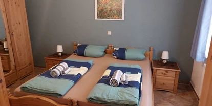 Rollstuhlgerechte Unterkunft - Unterkunftsart: Ferienhaus - großes Schlafzimmer - Freistehender Bungalow im Poggenhof auf Insel Rügen