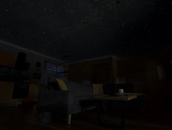 Rollstuhl-Urlaub: Wohnzimmer mit nachtleuchtende Sternendecke bei Dunkelheit. - Ferienhaus "Milchstraße" im Natur- und Sternenpark Westhavelland