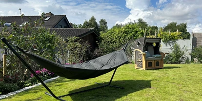 Rollstuhlgerechte Unterkunft - Unterkunftsart: Ferienhaus - Garten mit Hängematte und Strandkorb - Stiftung Friedrich Wilhelm und Monika Kertz - Haus 2