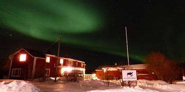 Rollstuhlgerechte Unterkunft - Unterkunftsart: Gästehaus - Süd-Lappland - The beautiful Northern Lights over The Friendly Mose - The Friendly Moose Lapland