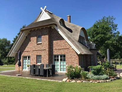Rollstuhlgerechte Unterkunft - Unterkunftsart: Ferienhaus - Ferienhaus"Rügen-Traum mit großer Terrasse, direkt aus WZ und SZ mit Rollstuhl befahrbar - Ferienhaus“Rügen-Traum“ für bis zu 8 Personen auf Rügen