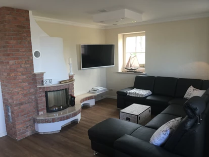 Rollstuhlgerechte Unterkunft - Unterkunftsart: Ferienhaus - XXL Wohnzimmer mit Kamin Ferienhaus"Rügen-Traum" - Ferienhaus“Rügen-Traum“ für bis zu 8 Personen auf Rügen