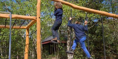 Rollstuhlgerechte Unterkunft - Unterkunftsart: Ferienhaus - Spielplatz - Dronningens Ferieby