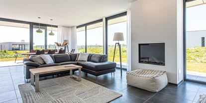 Rollstuhlgerechte Unterkunft - Unterkunftsart: Ferienhaus - Wohnzimmer - Duinvallei 22