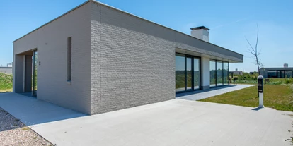 Rollstuhlgerechte Unterkunft - Unterkunftsart: Ferienhaus - Außenansicht - Duinvallei 22