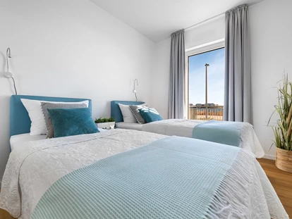Rollstuhlgerechte Unterkunft - Schlafzimmer mit zwei Einzelbetten - Ocean Terrace