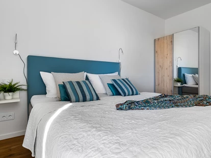 Rollstuhlgerechte Unterkunft - Schlafzimmer mit einem Doppelbett - Ocean Terrace