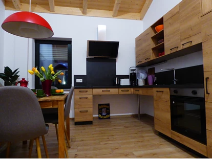 Rollstuhlgerechte Unterkunft - Unterkunftsart: Ferienhaus - Küche - Ferienhaus Wollinger