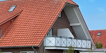 Rollstuhlgerechte Unterkunft - Pflegebett - Außenansicht Balkon - Kleine Auszeit Werdum